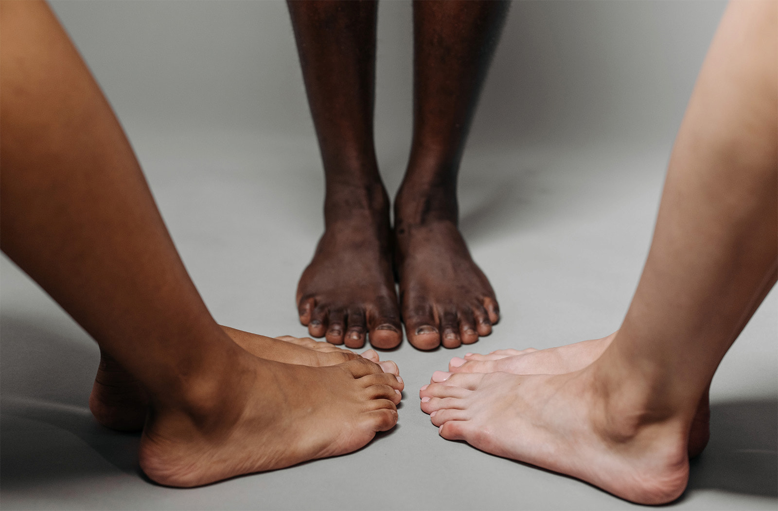 Feet of different people brought together